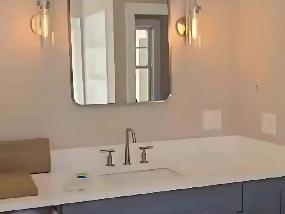 Bathroom Deep Cleaning showcasing a sanitized sink area, polished mirror, and clean fixtures.