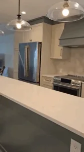 Complete Kitchen Cleaning: Another angle of the well-maintained kitchen, featuring modern appliances and a polished countertop.