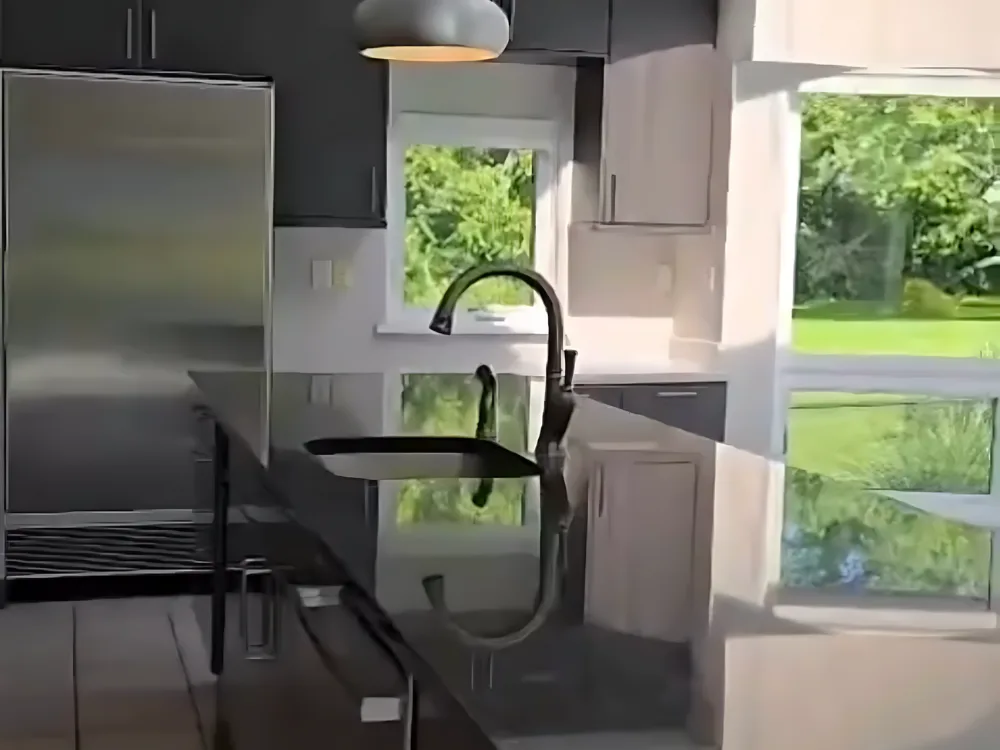 After complete kitchen cleaning, with spotless appliances, cabinets, hood, and lighting fixtures.