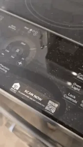 Close-up of a stove control panel before kitchen deep cleaning.