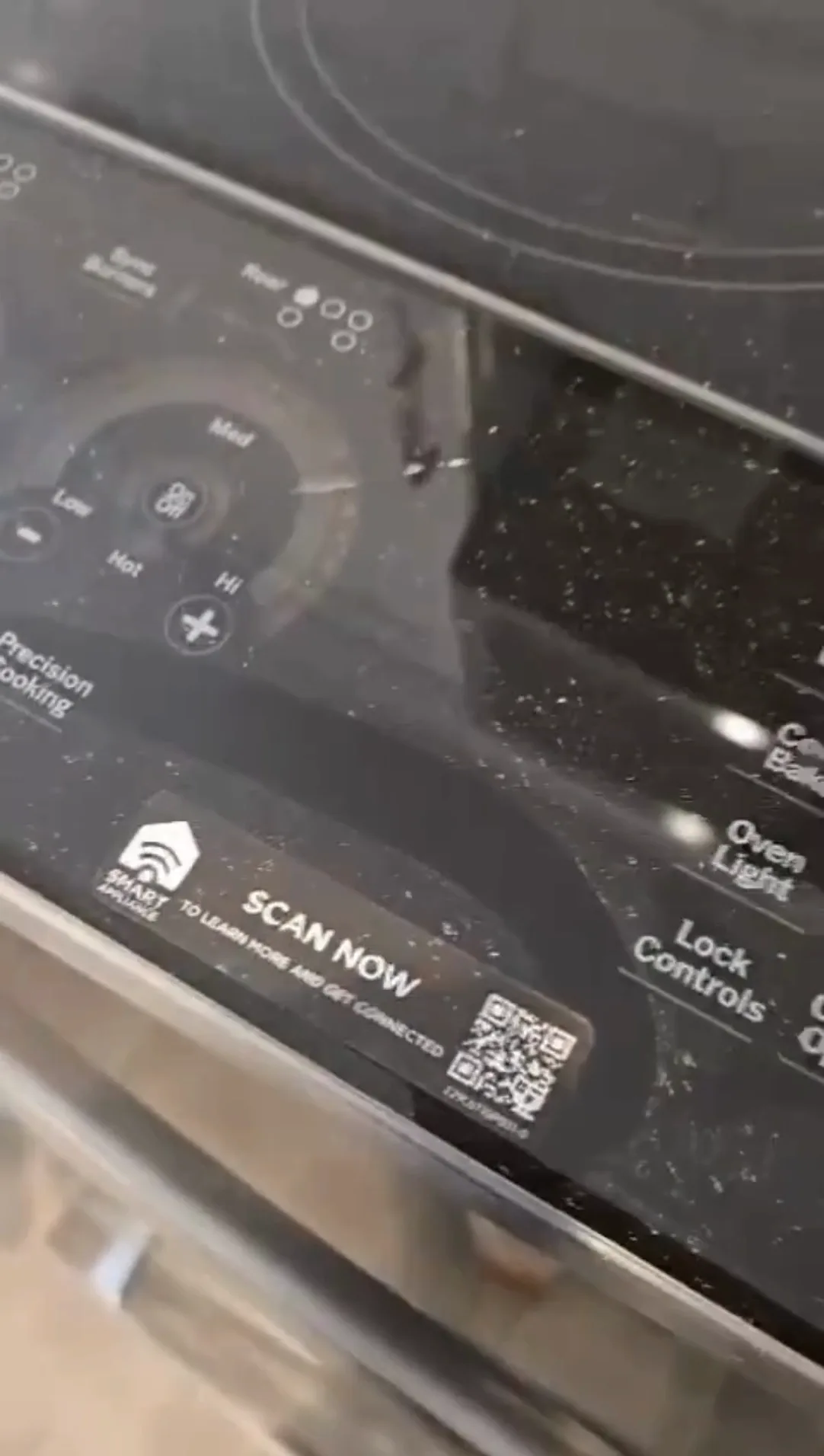 Close-up of a stove control panel before kitchen deep cleaning.