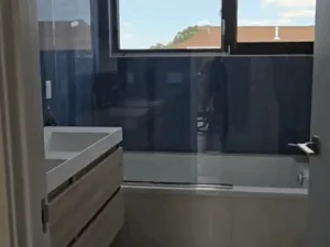 Bathroom Cleaning process showing sink and bathtub area