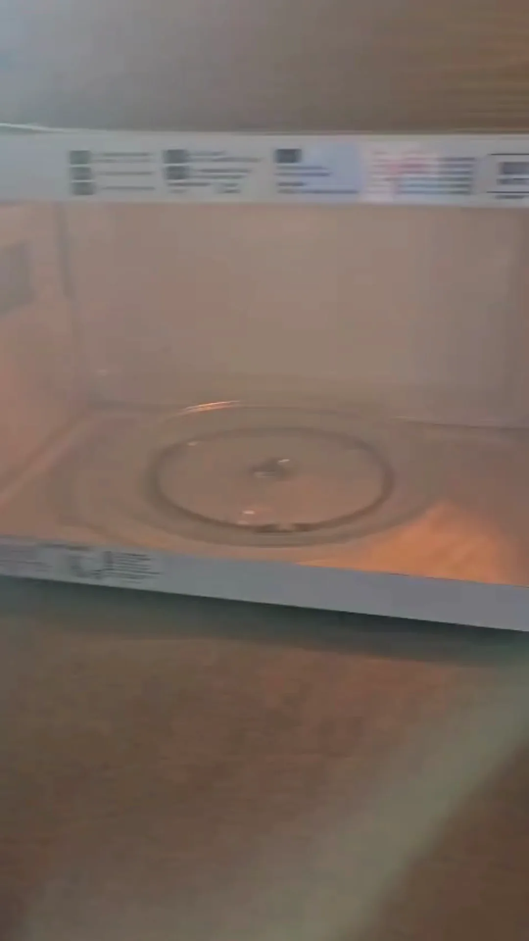 Microwave interior cleaning showing the appliance fully open