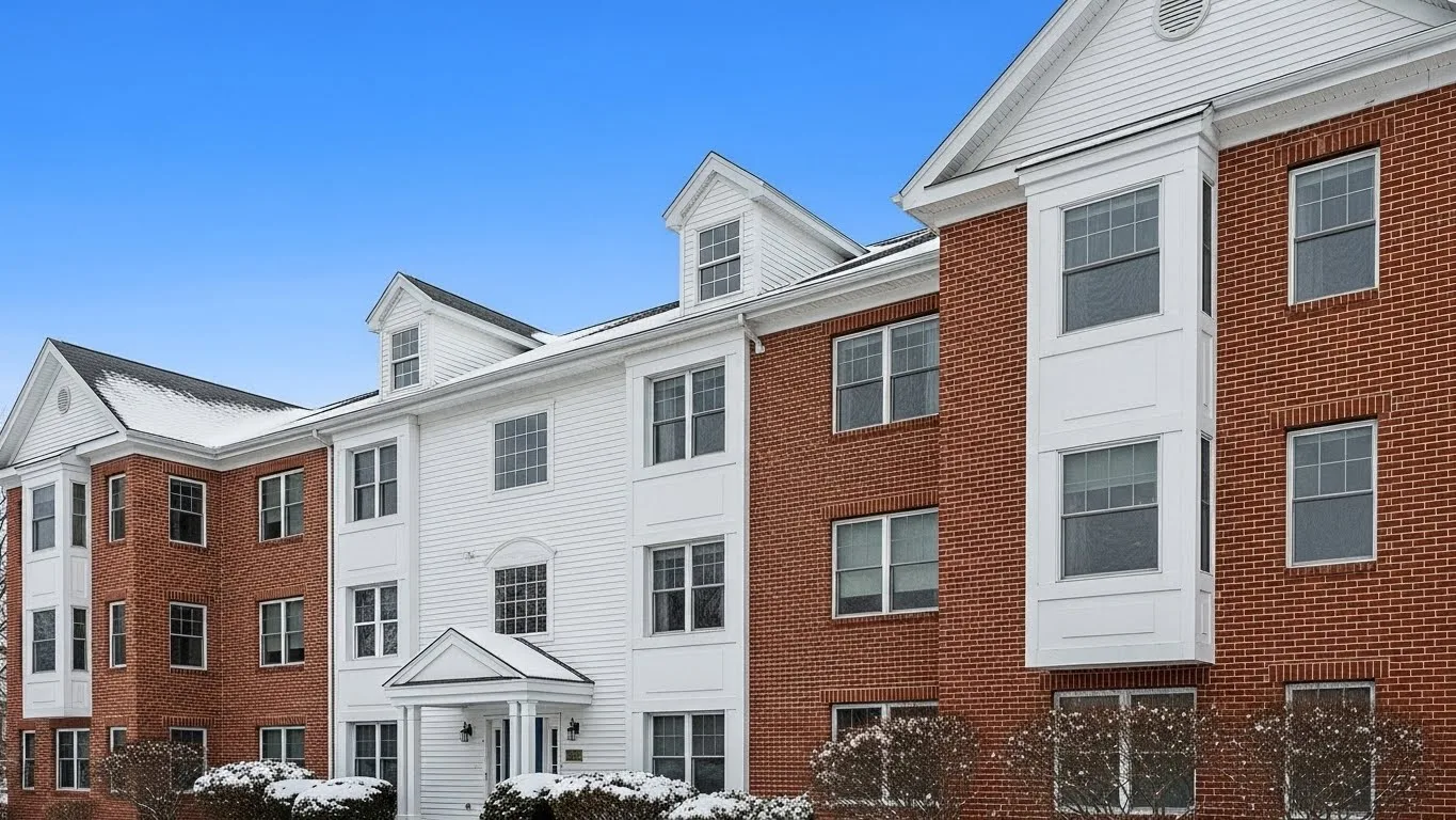 Condo Hallway exterior view of a Connecticut condominium building during winter with snow on the ground